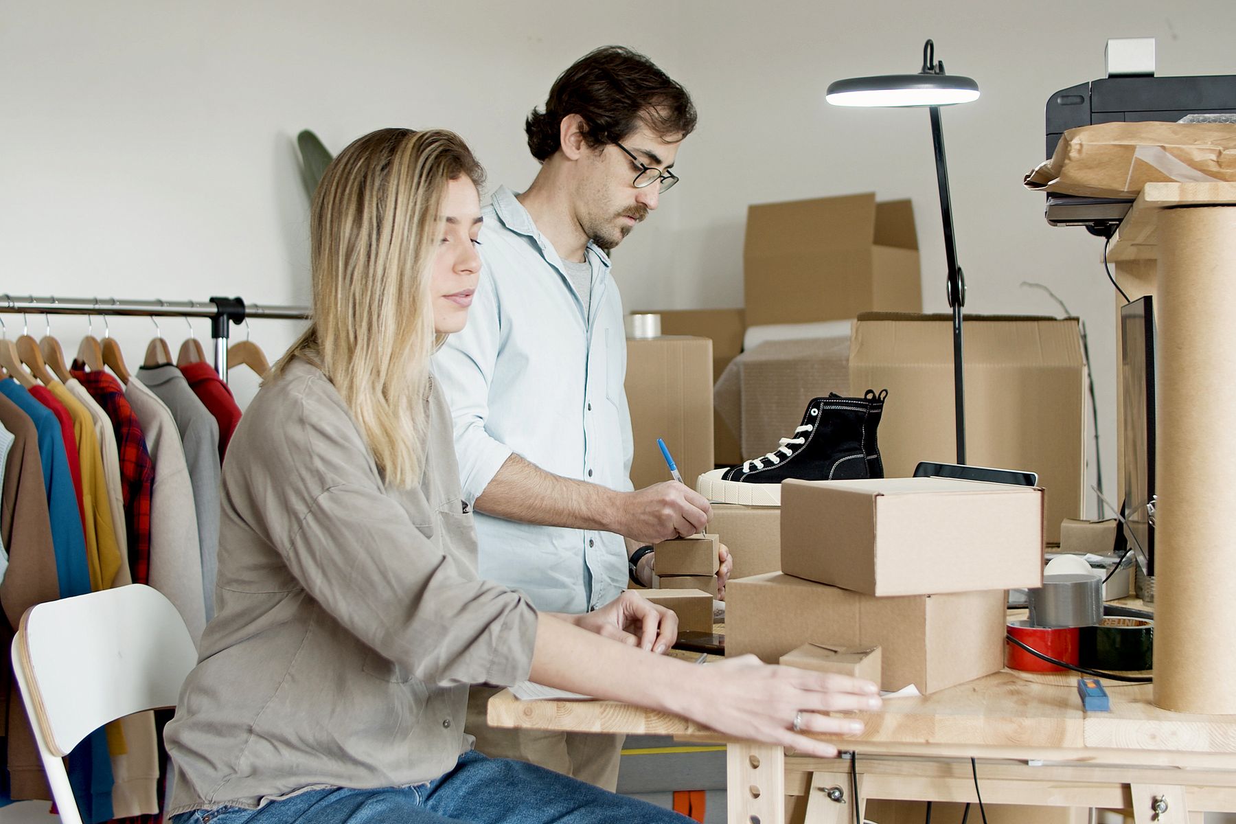 Two independent business owners preparing customer orders